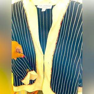 St. John knit pinstripe jacket. Size 14. Black and cream. One hook closure.
